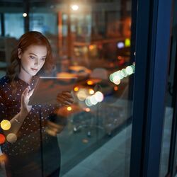 Cropped shot of a young businesswoman working late on a digital tablet in an office