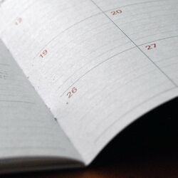 Calendar book lying on table